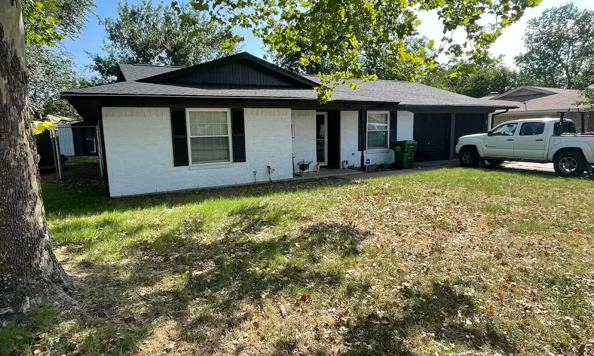 Professional roofing crew working on a residential roof in Lansdale